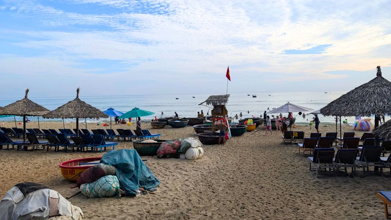 An Bang Beach Hoi An in July morning swimming calm water basket boats