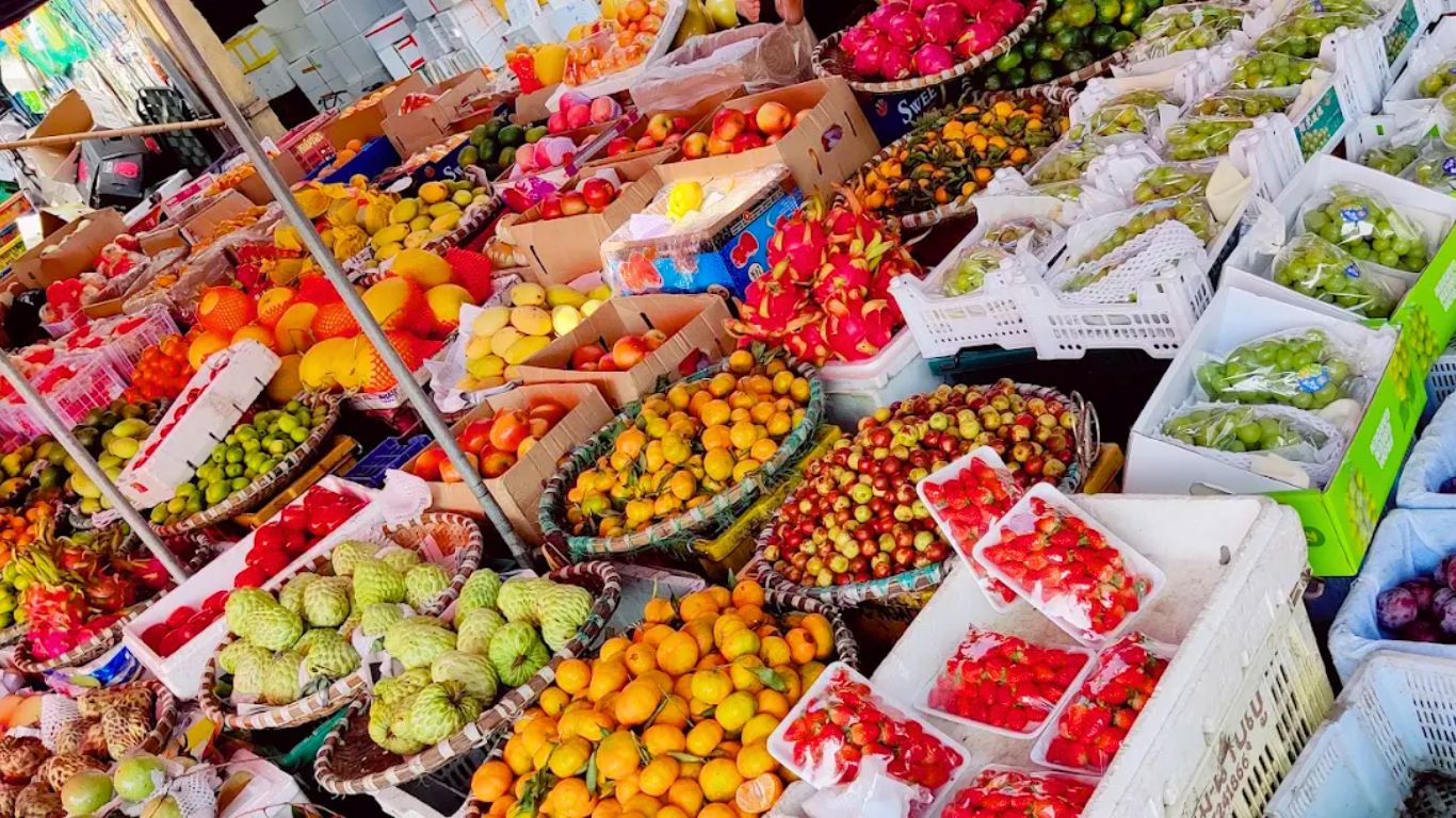 Hanoi market tropical fruit season July lychee dragon fruit mango summer